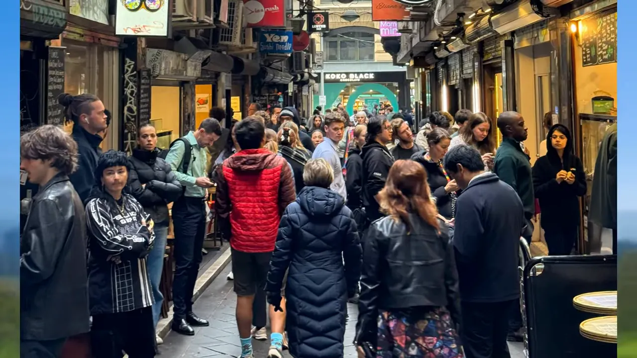 Group walking a laneway on a food tour, sampling dumplings