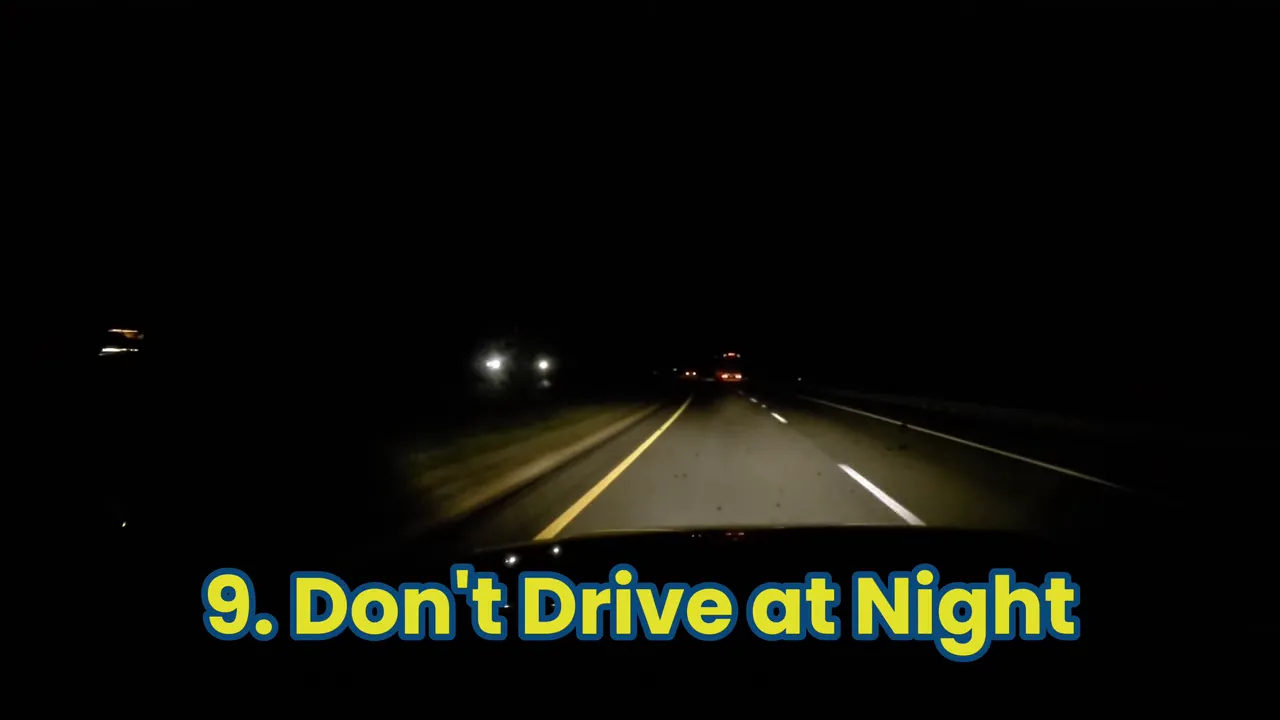 View from a car driving on a dark rural highway at night with headlights visible and on-screen text 'Don't Drive at Night'